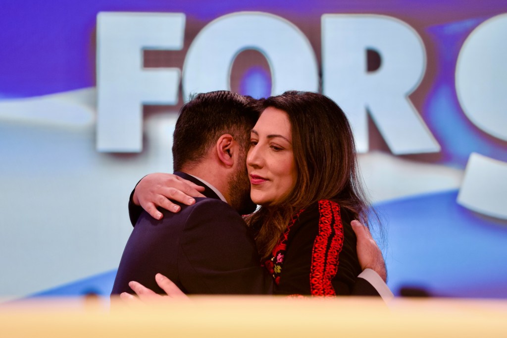 First Minister Humza Yousaf hugs wife Nadia El-Nakla